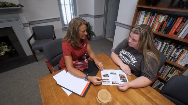 recent graduate receiving help in the career services office 