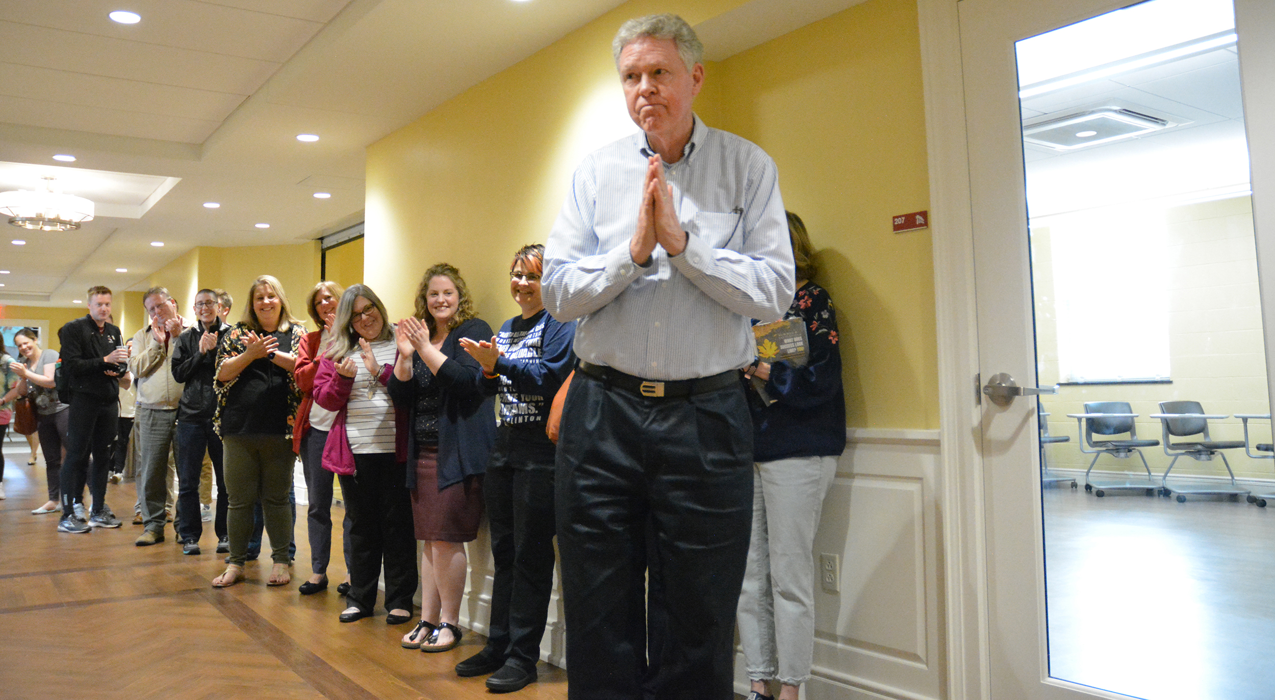 Jones being cheered in a hallway
