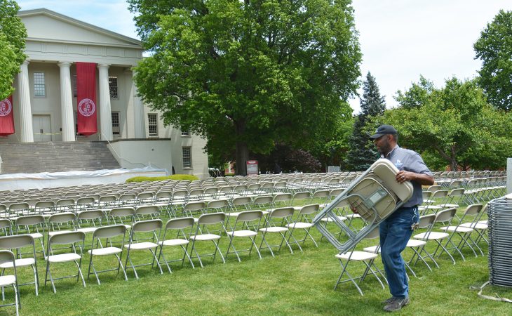 Putting out chairs on Old Morrison lawn