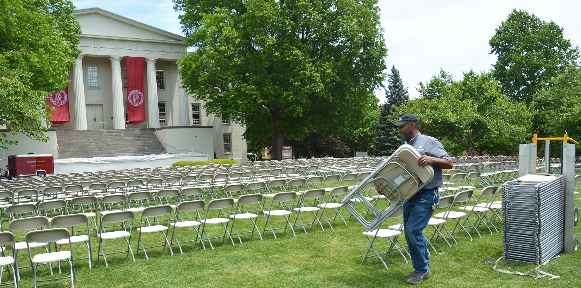 Putting out chairs on Old Morrison lawn