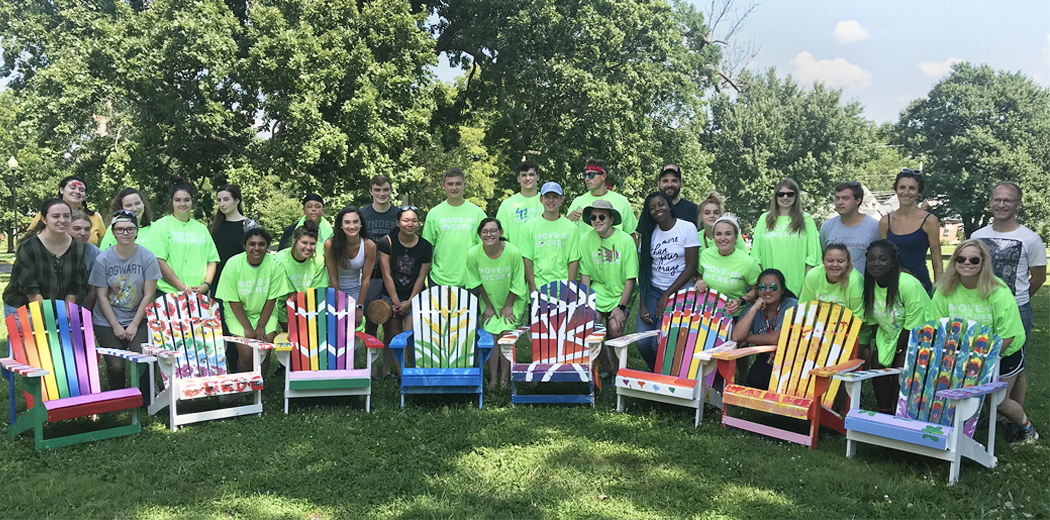 Students with painted chairs