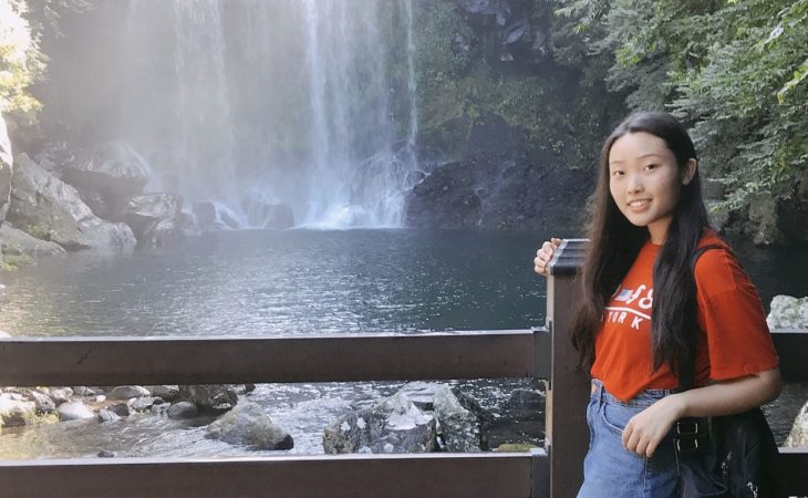 Grace Kim by a waterfall