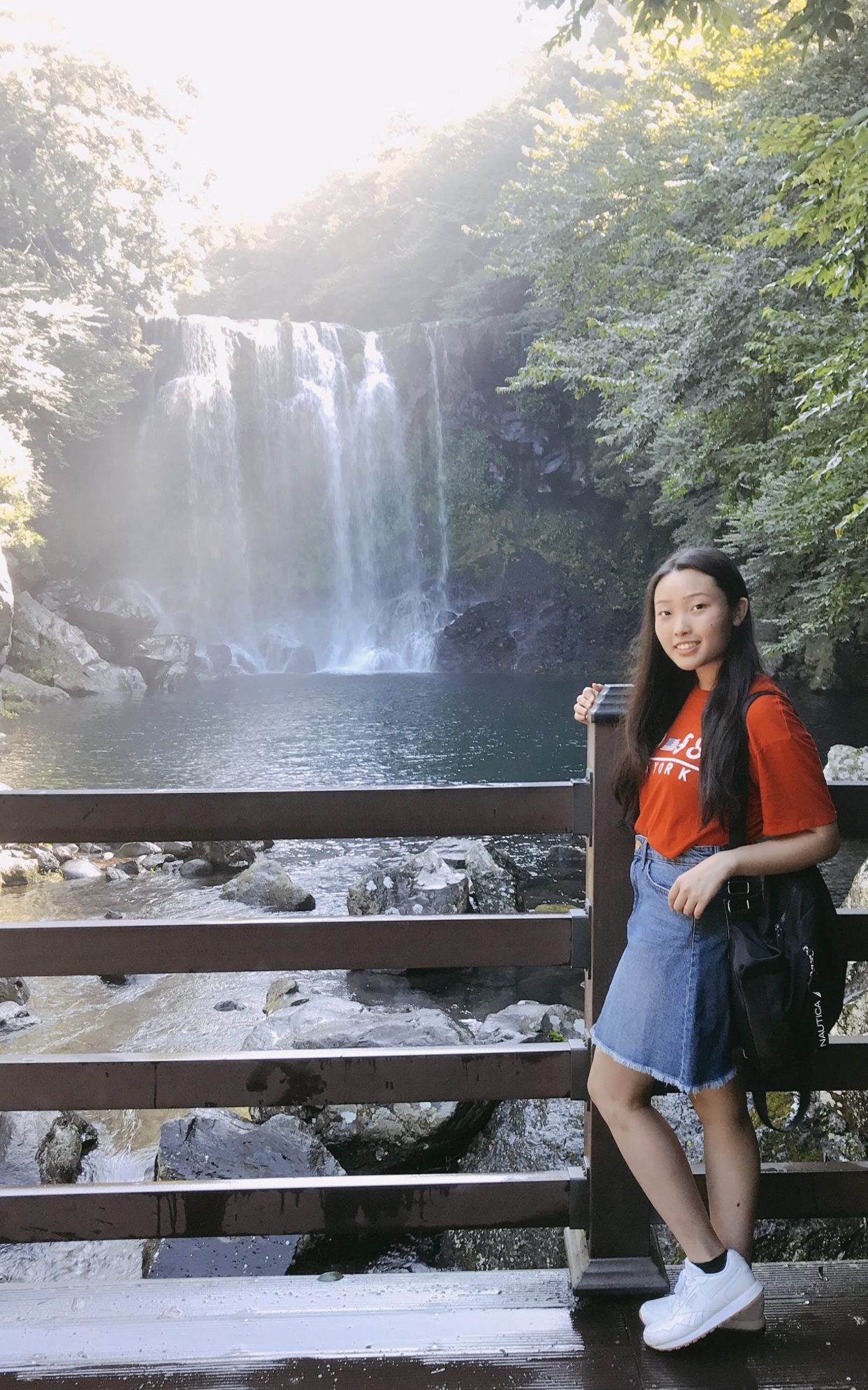 Grace Kim by a waterfall