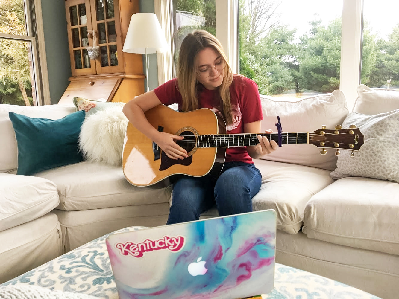 Taylor playing guitar