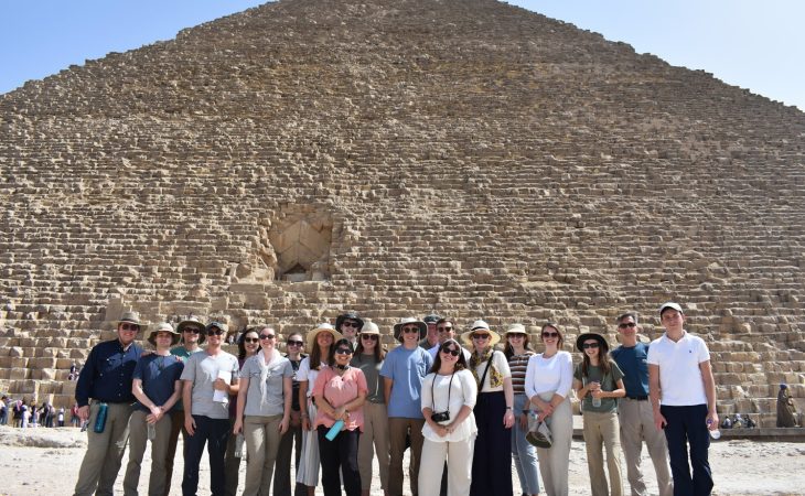 people in front of a pyramid