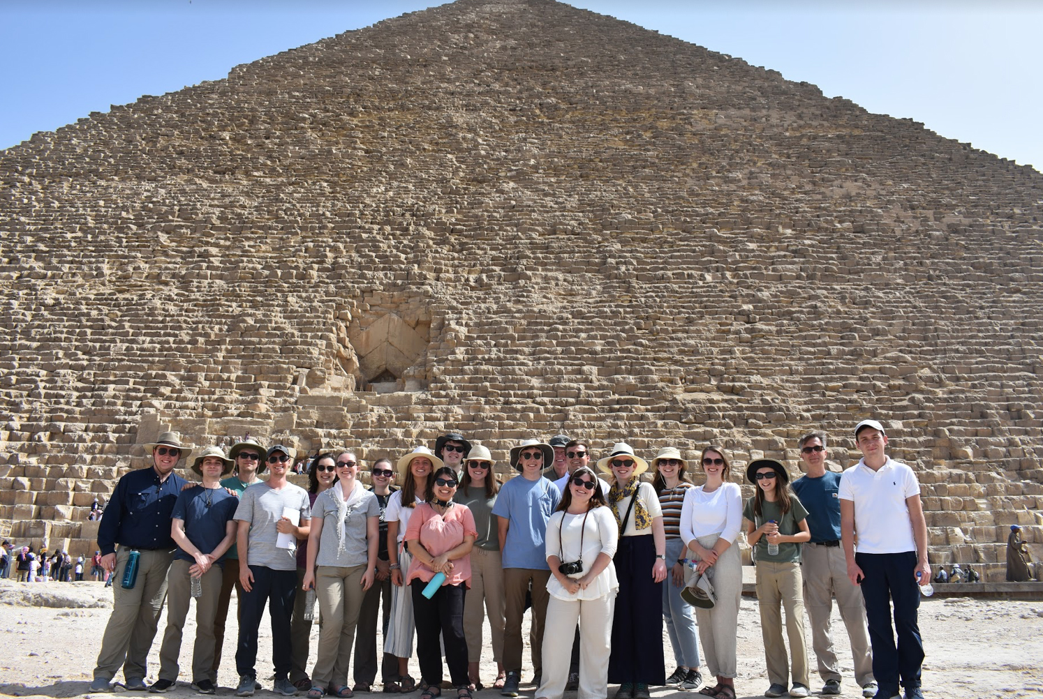 people in front of a pyramid