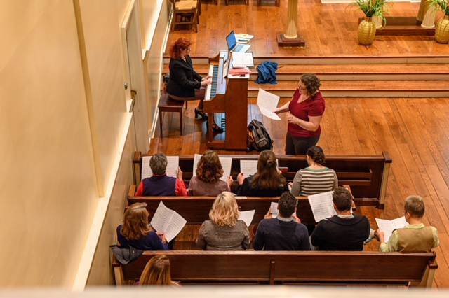 MacNay leads a group of singers in Old Morrison Chapel during a previous year.
