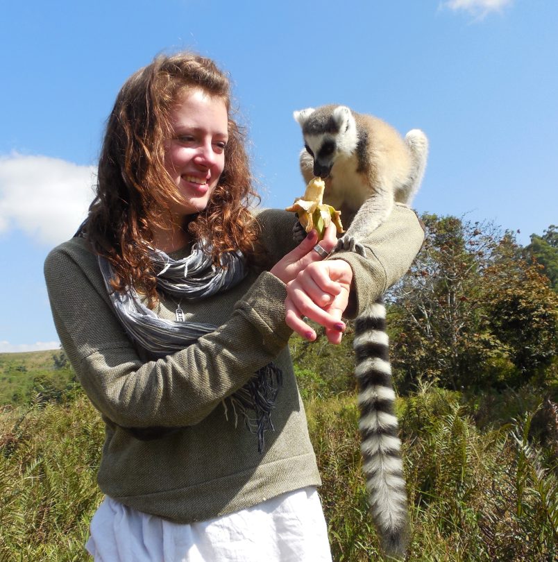 Raisa Tikhtman '14 feeds a lemur during her undergraduate travel to Madagascar, where she studied traditional medicine.