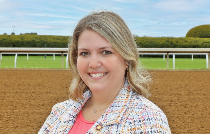 Betsy May in front of Keeneland track