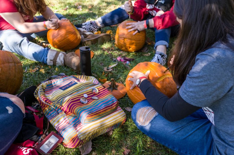 Students carving pumpkins at Transylvania University.