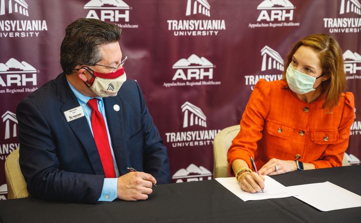 Appalachian Regional Healthcare President and CEO Hollie Harris Phillips and Transylvania President Brien Lewis sign a memorandum of understanding between the two organizations that provides an incentive for students to return to the region following completion of their degree.
