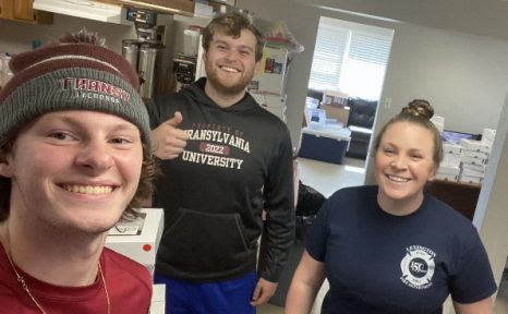 three people in a firehouse