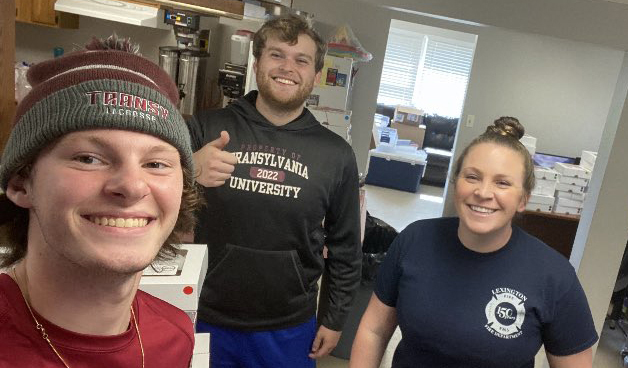 Transylvania lacrosse players recognize local firefighters with monster cookie delivery