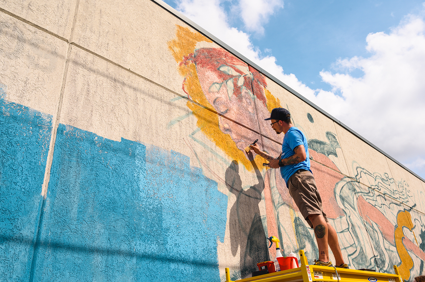 artist painting a mural