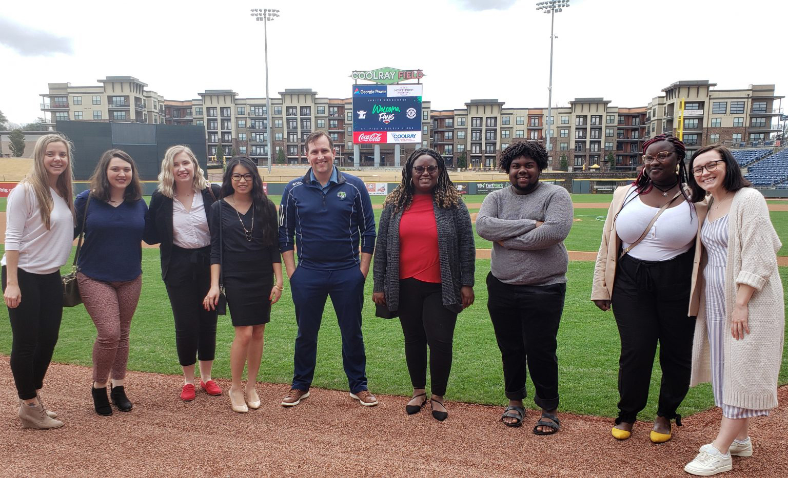 people standing on a baseball field