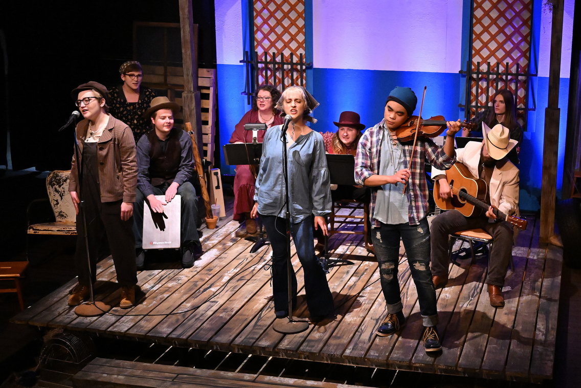 people playing music on stage