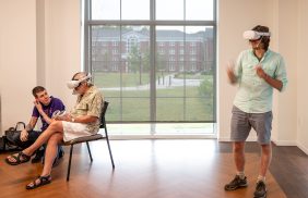 people in a room wearing VR headsets