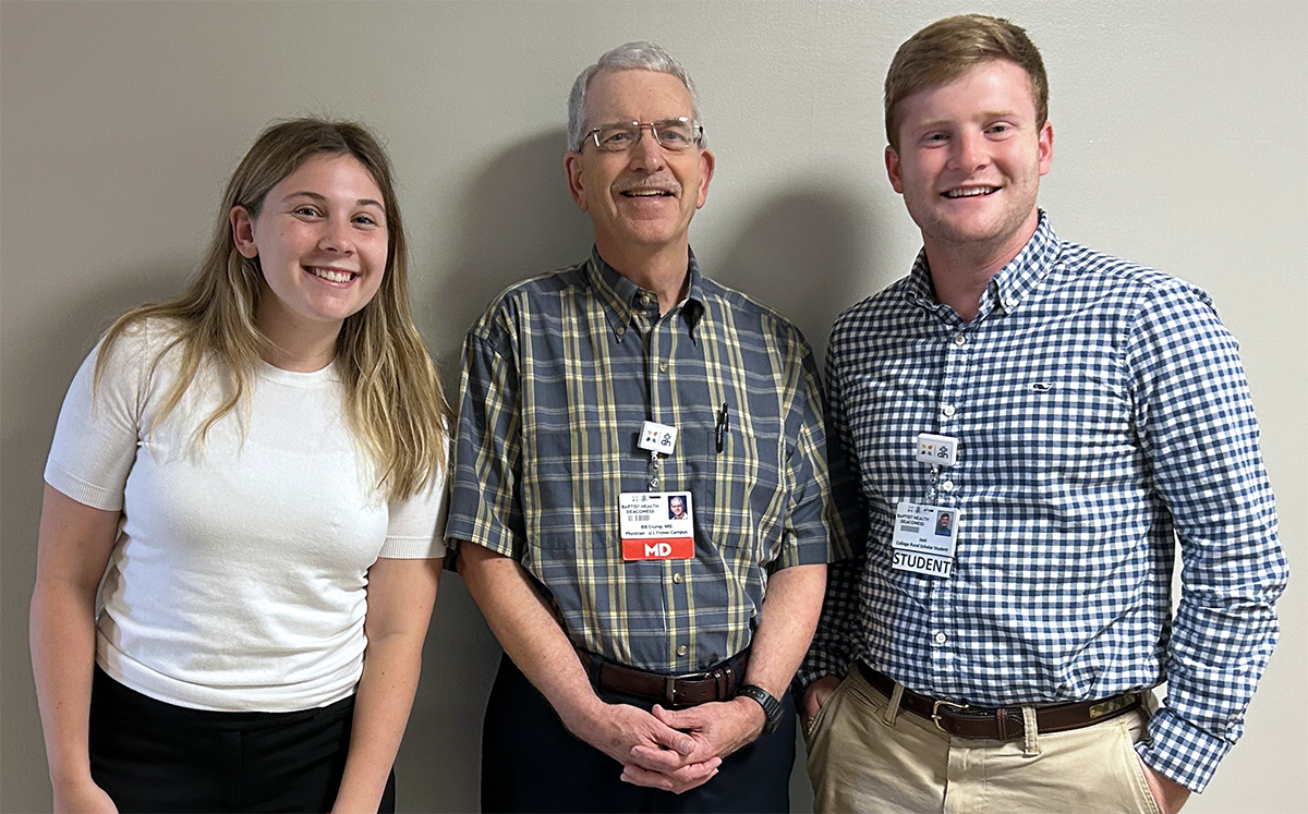 three people posing for a photo