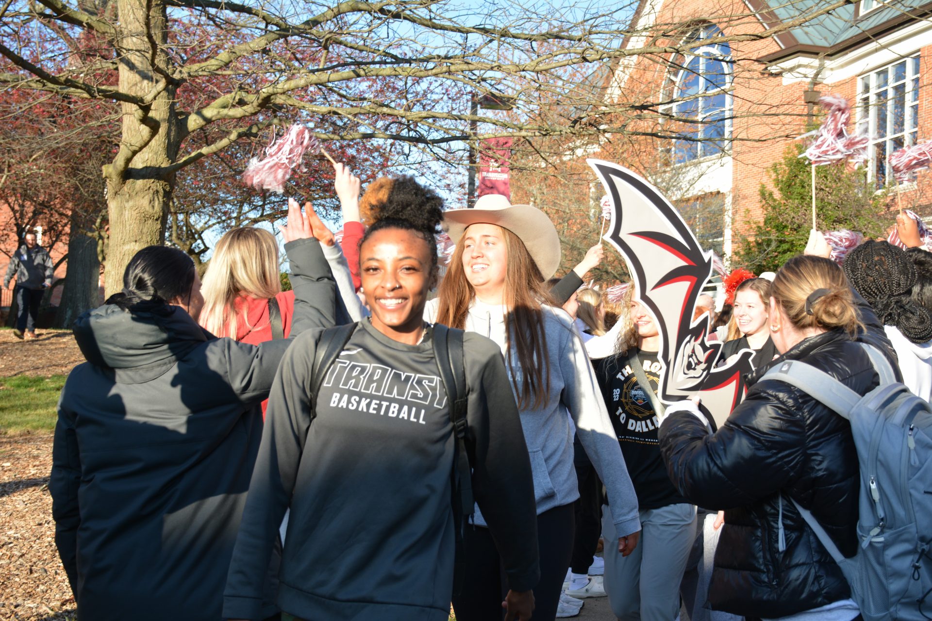 Members of the 2023 women's basketball team depart for the championship.