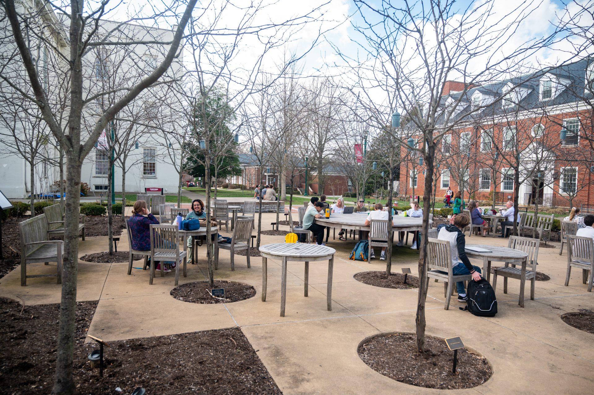Students and faculty outside in Alumni Plaza in March 2024.
