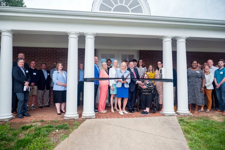 A group of people prepare to cut a ribbon in front of Transylvania's Center for Entrepreneurship