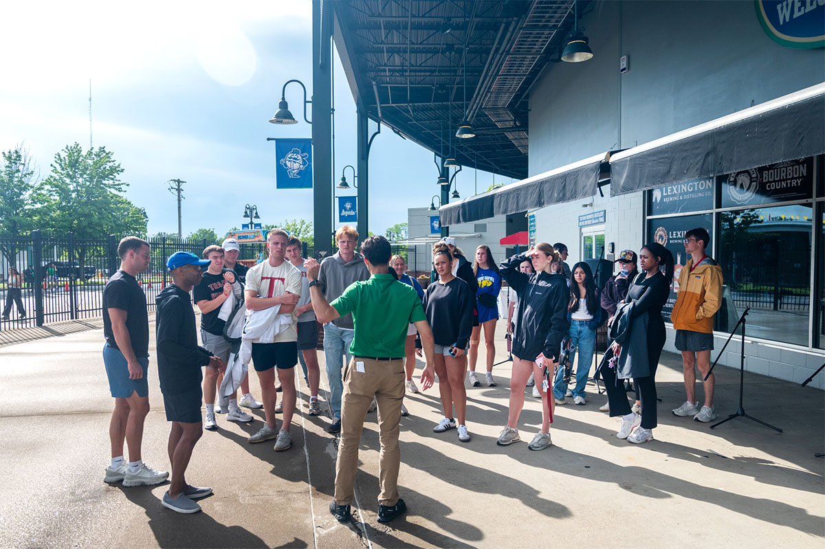 students at a baseball stadium