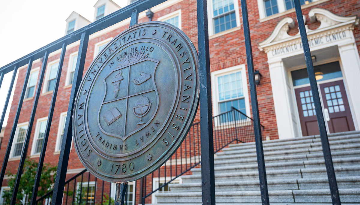 university seal attached to a railing