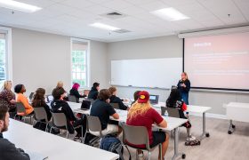 students and a teacher in a classroom