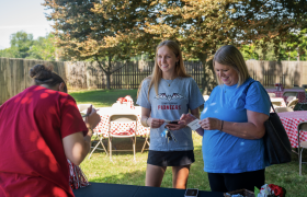 people standing on a lawn