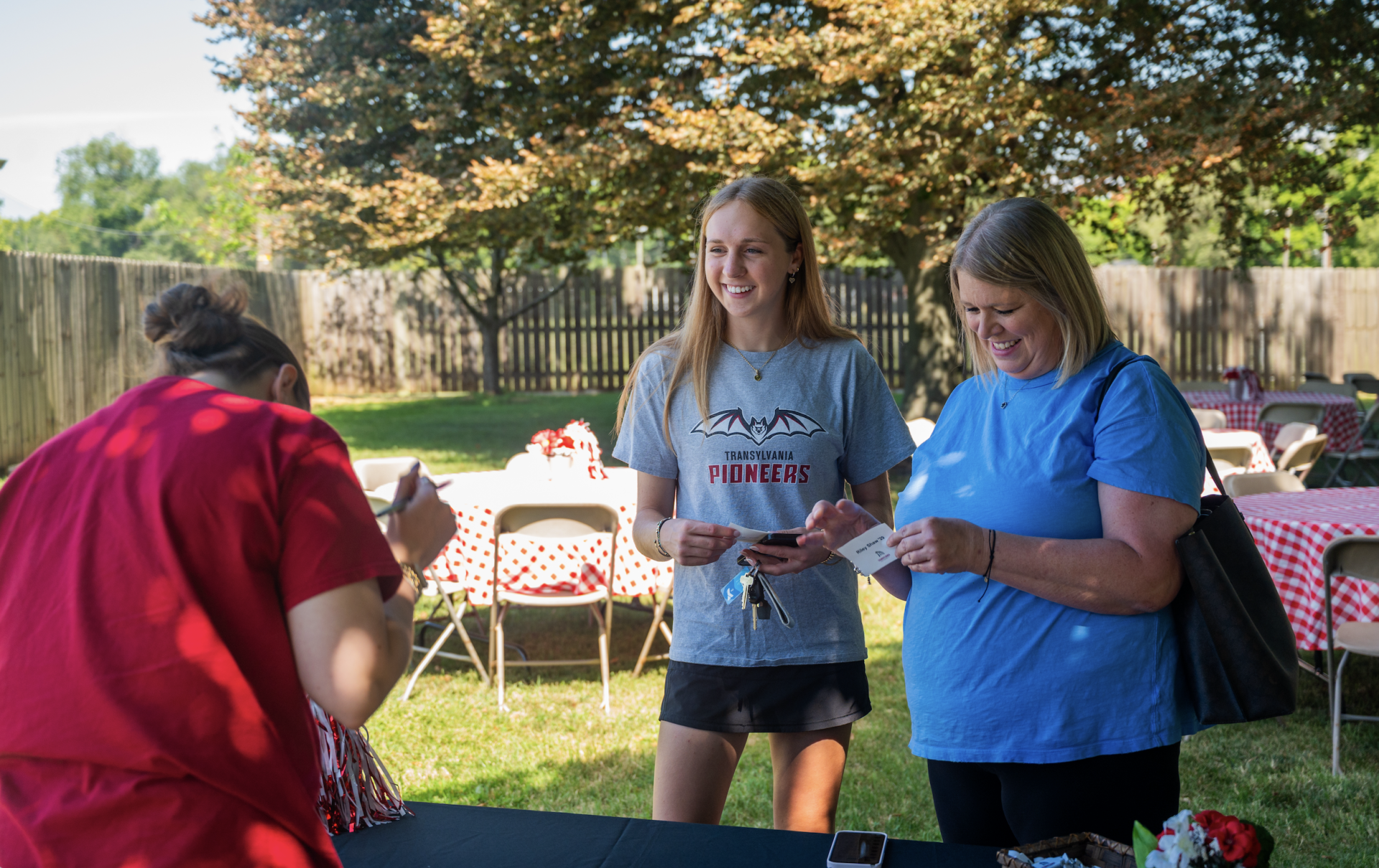 people standing on a lawn
