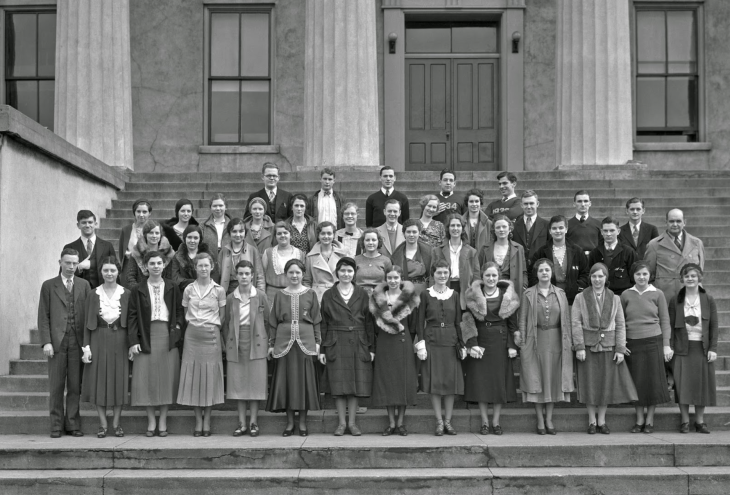 students on the steps of a campus building in 1932
