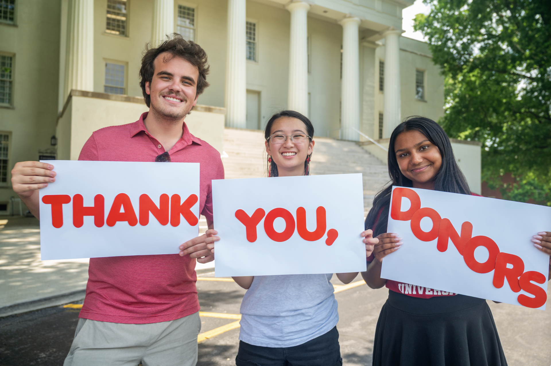 students holding signs