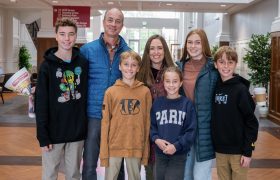 a family posing for a photo indoors