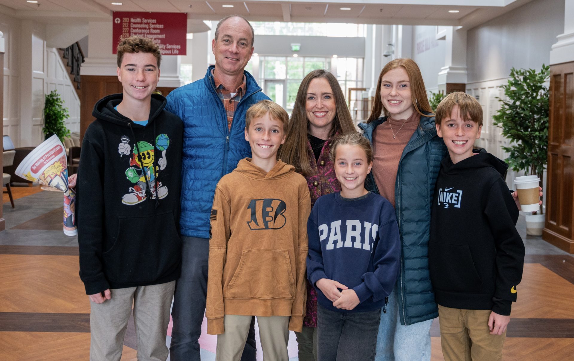 a family posing for a photo indoors