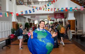 person dressed in a globe costume