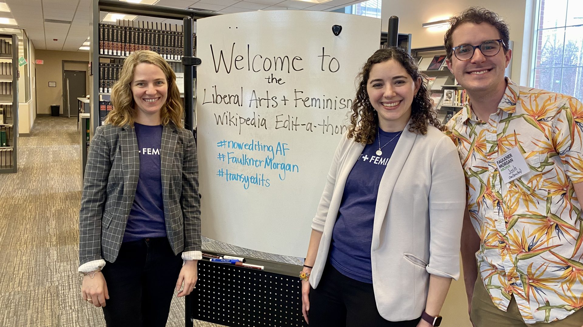 people gathered around a sign