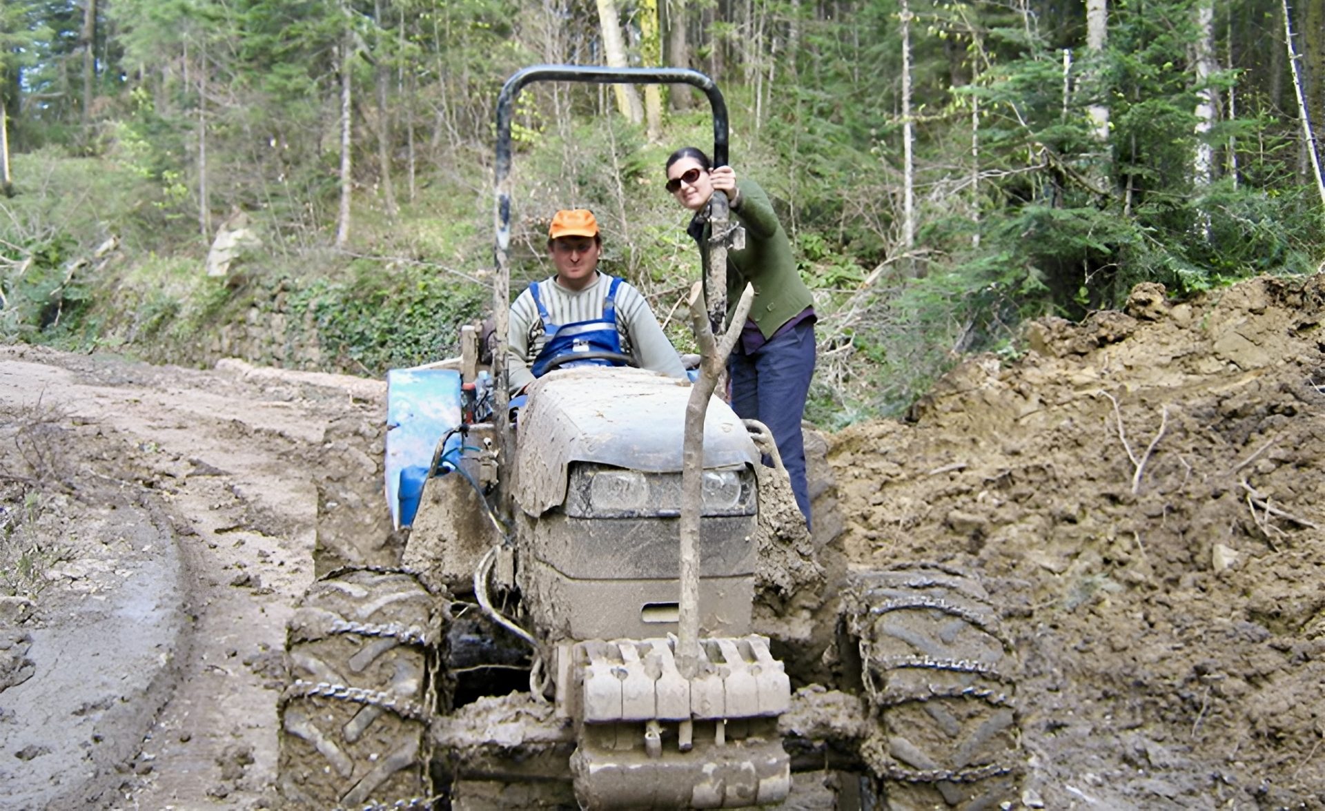 two people on a tractor