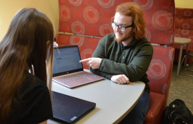 students looking at a laptop