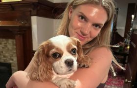 person holding a dog