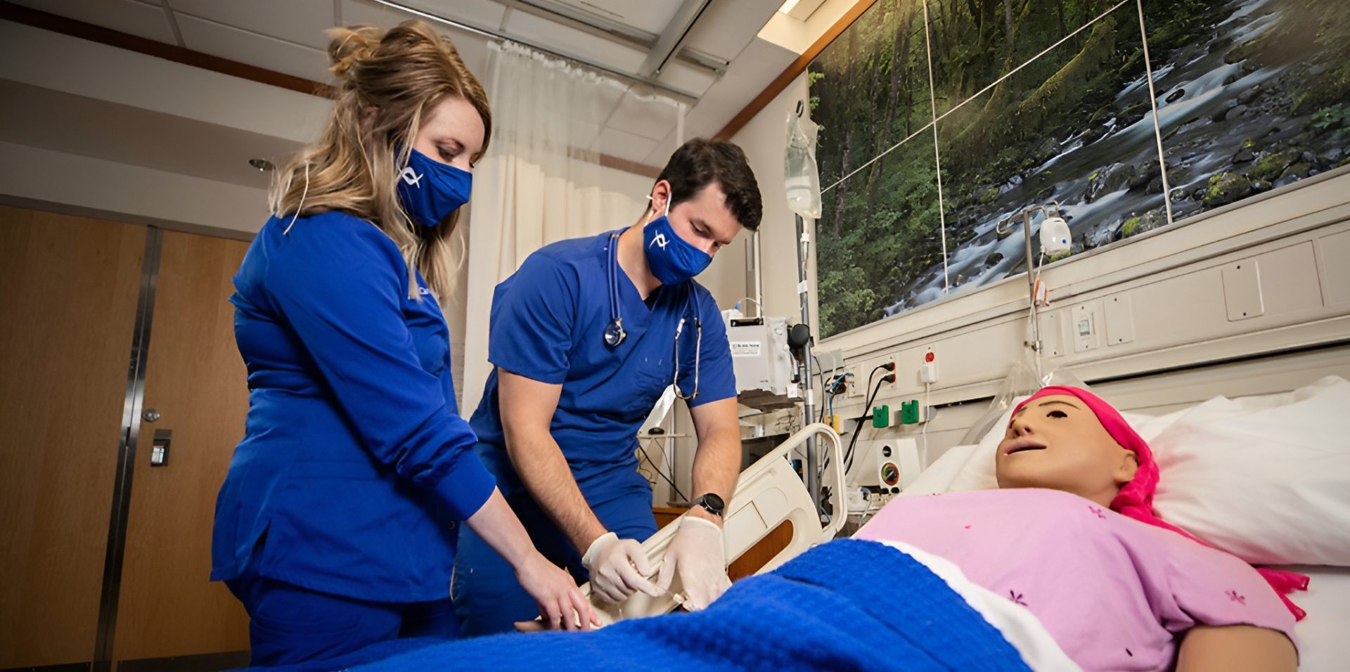 students practicing on a manikin