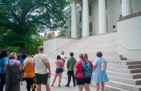 students in front of a campus building
