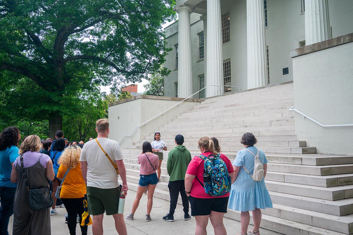 students in front of a campus building