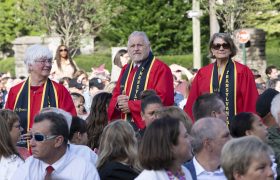 people walking at commencement