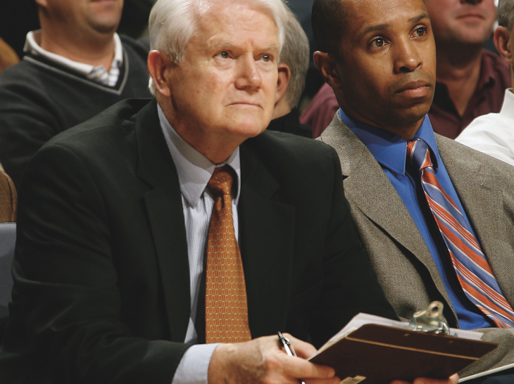 A basketball coach with a clipboard