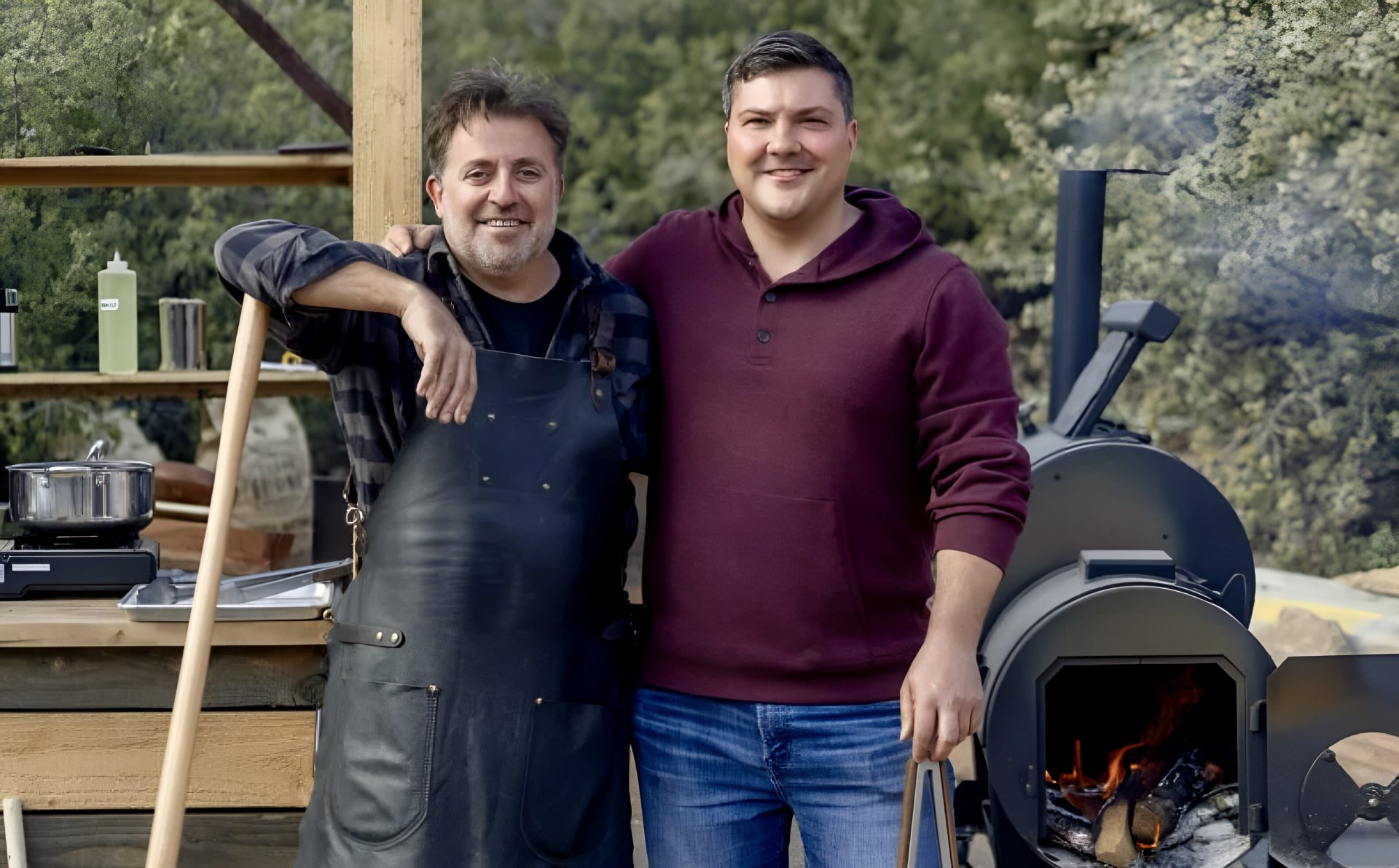 two people in front of a smoker