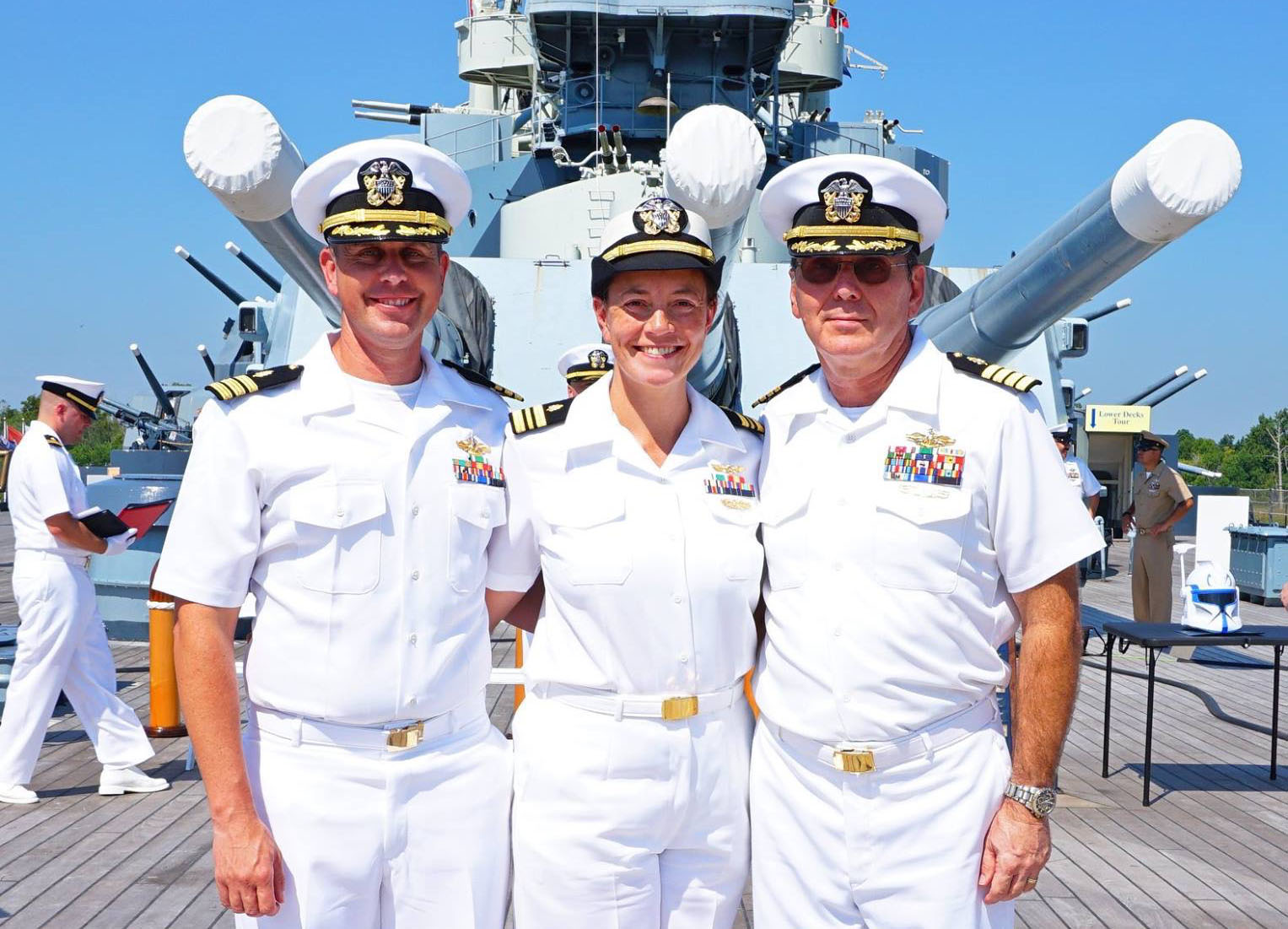 three navy doctors posing on a ship