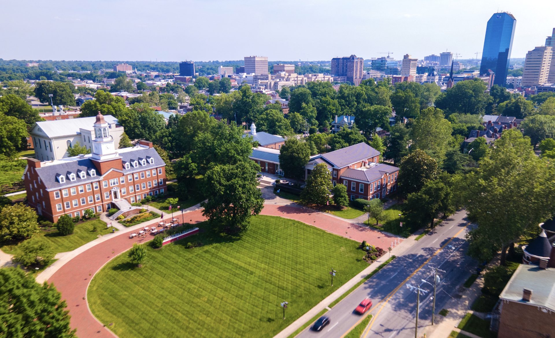 a college campus with a city skyline in the background