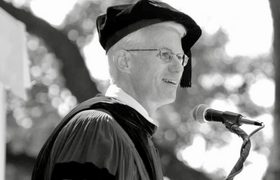 a man giving a commencement address