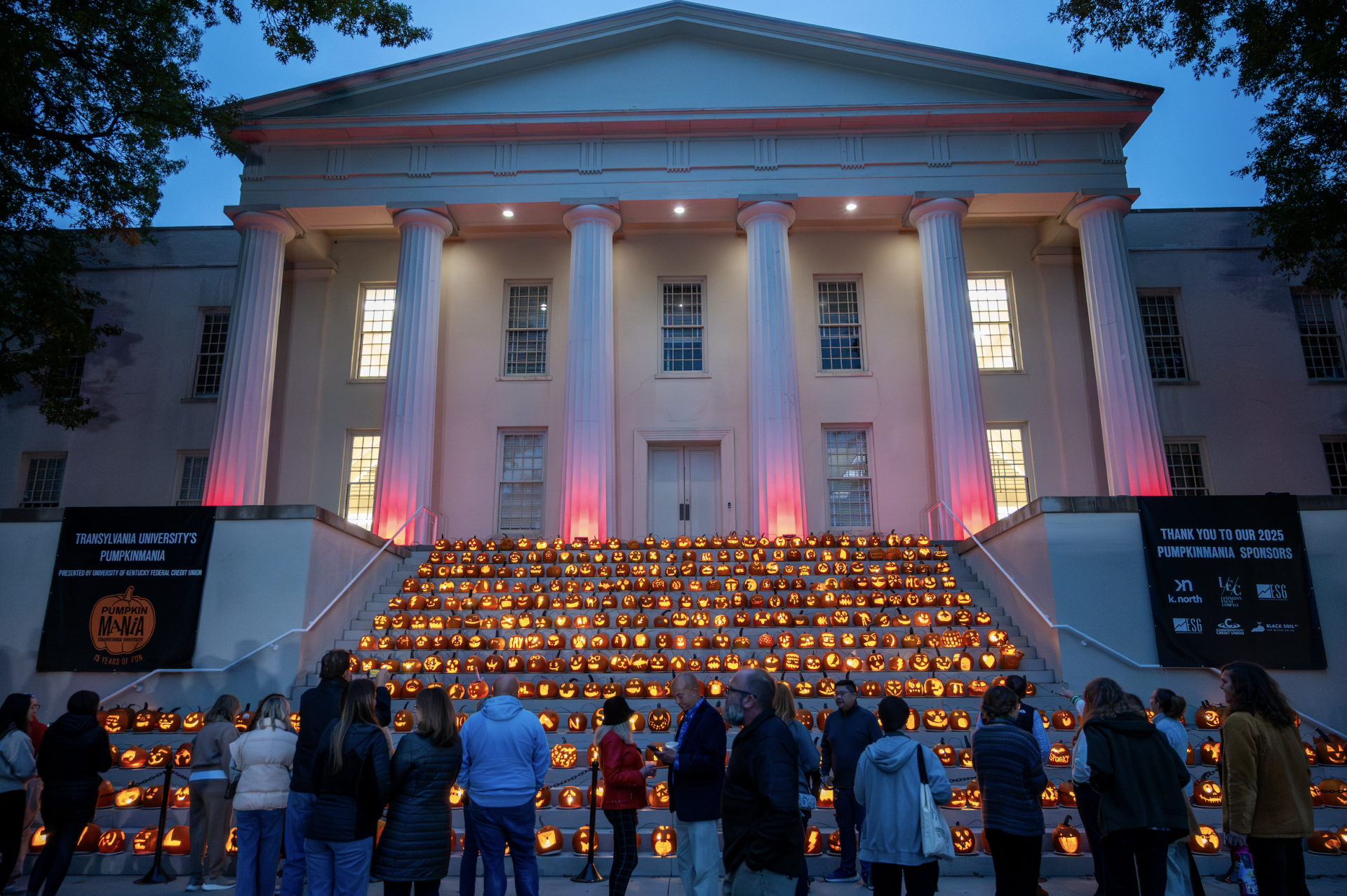 pumpkins glowing on the steps of a campus building