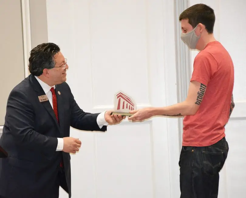 Tristan Kline receives the President's Award for Outstanding Newcomer
